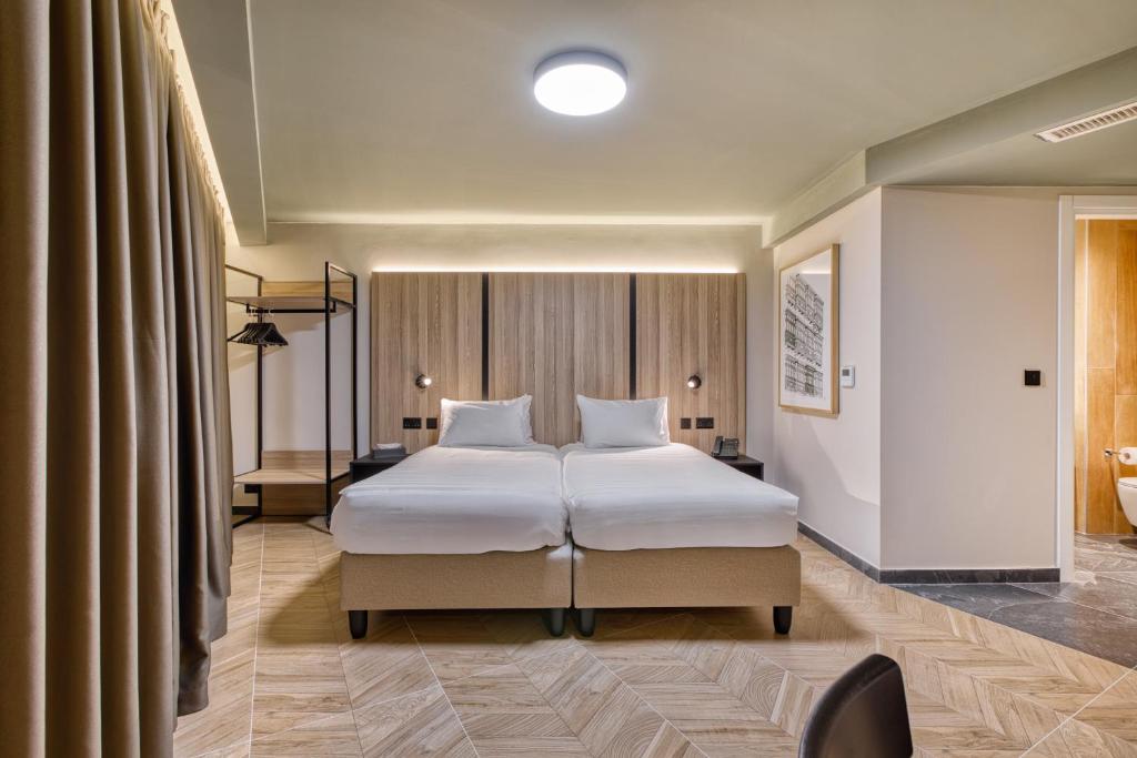 Postel nebo postele na pokoji v ubytování VITA Hotel