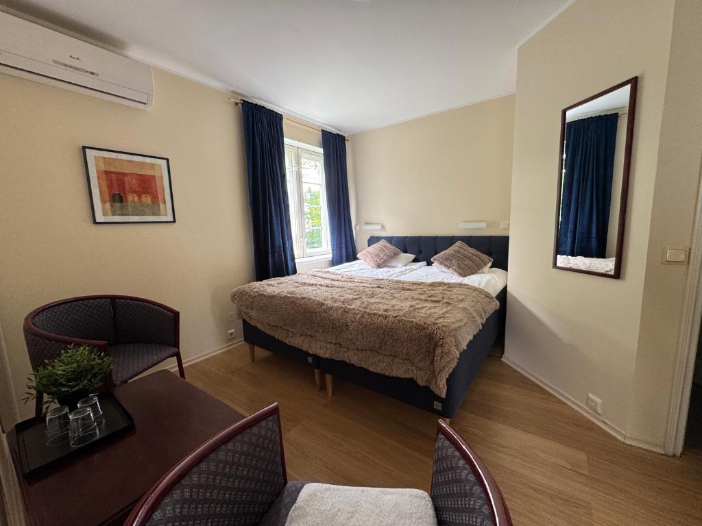 Postel nebo postele na pokoji v ubytování Inge Villa Apartment Hotel