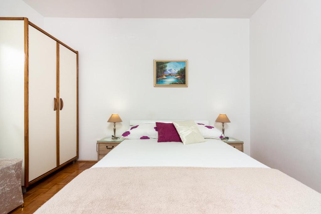 Posteľ alebo postele v izbe v ubytovaní Apartments Cordis