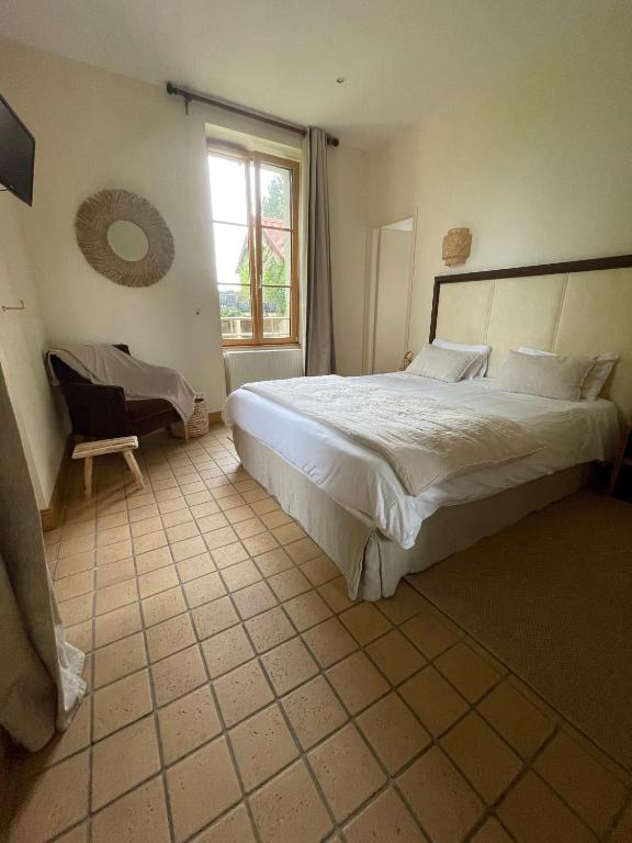 Postel nebo postele na pokoji v ubytování Auberge Côté Rivière