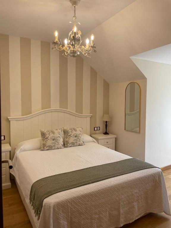 A bed or beds in a room at Apartamento Ons Sanxenxo