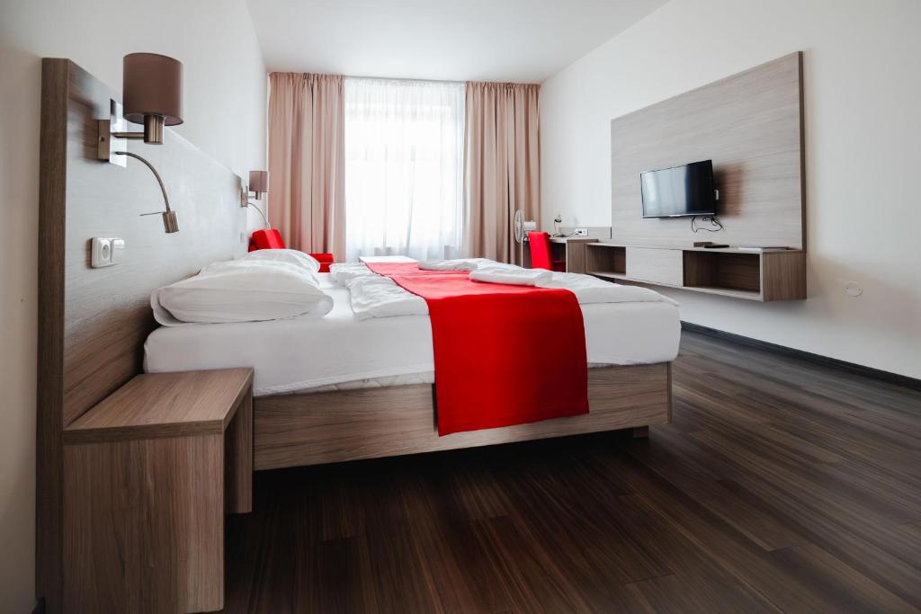 Postel nebo postele na pokoji v ubytování Hotel Palác Elektra