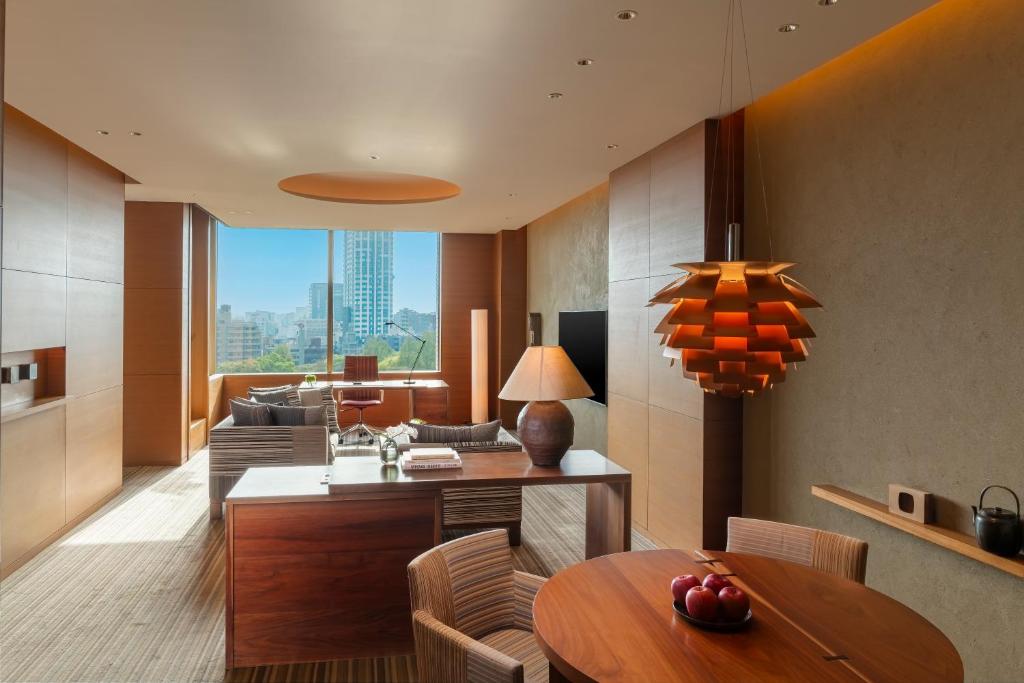 a kitchen and living room with a table and chairs at Hyatt Regency Tokyo in Tokyo