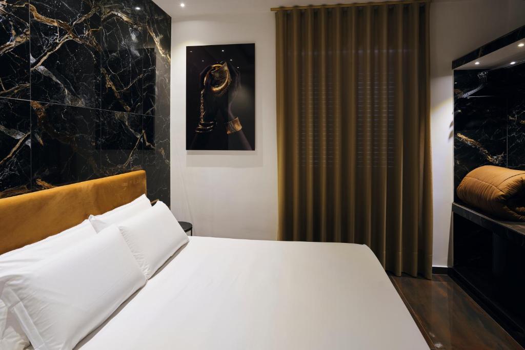 Posteľ alebo postele v izbe v ubytovaní Albergo Pompei Valley