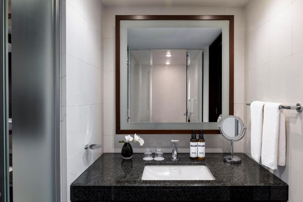 a bathroom with a sink and a mirror at Hyatt Regency Tokyo in Tokyo