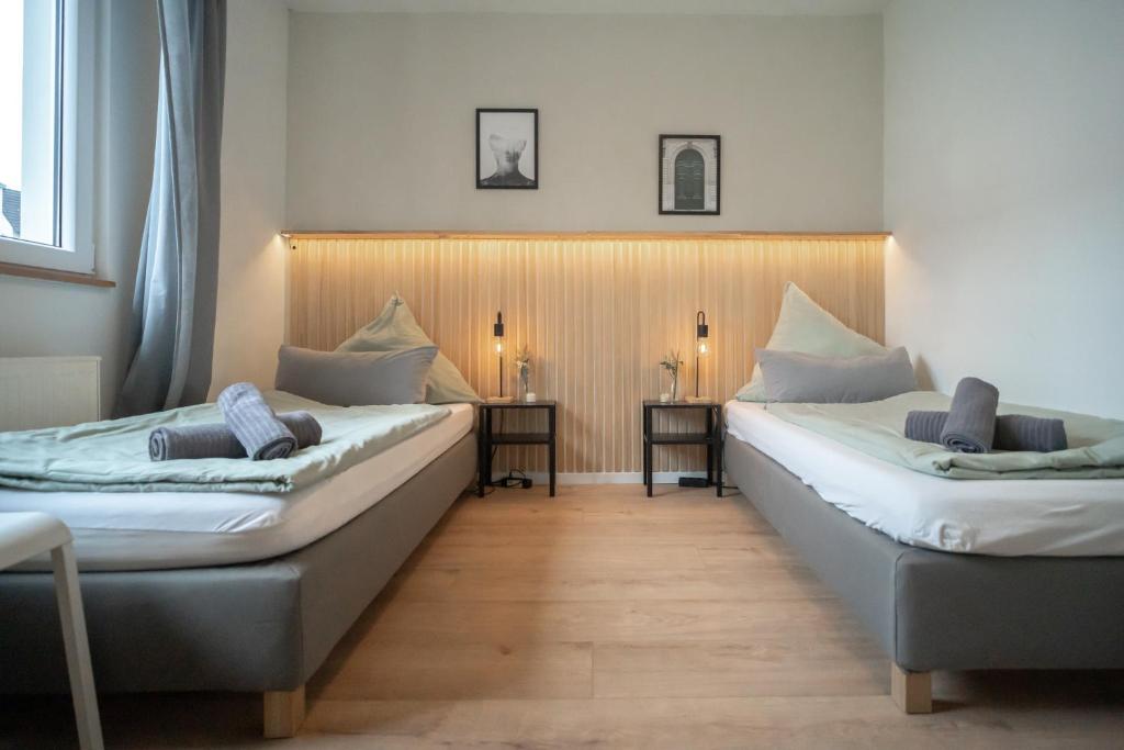 Postel nebo postele na pokoji v ubytování Juno Living - Witten Apartmenthaus