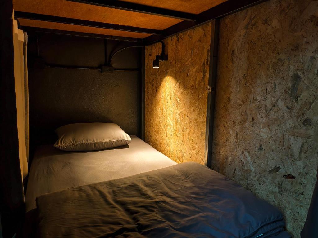 Postel nebo postele na pokoji v ubytování TIMN Hostel Female Only