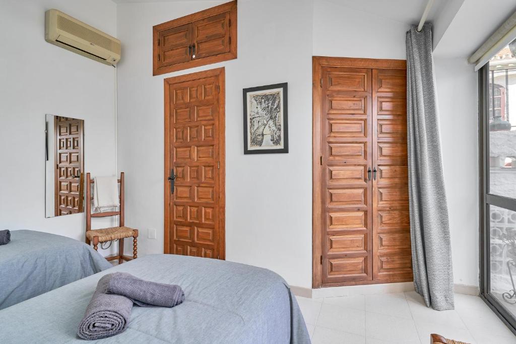Postel nebo postele na pokoji v ubytování Capistrano Village, Casa Halo Nerja