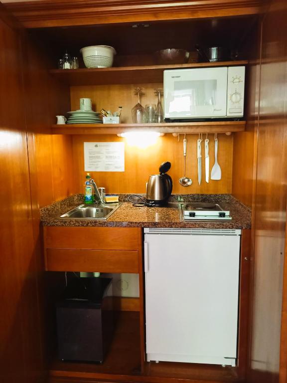 Kuchyň nebo kuchyňský kout v ubytování Hotel Artushof