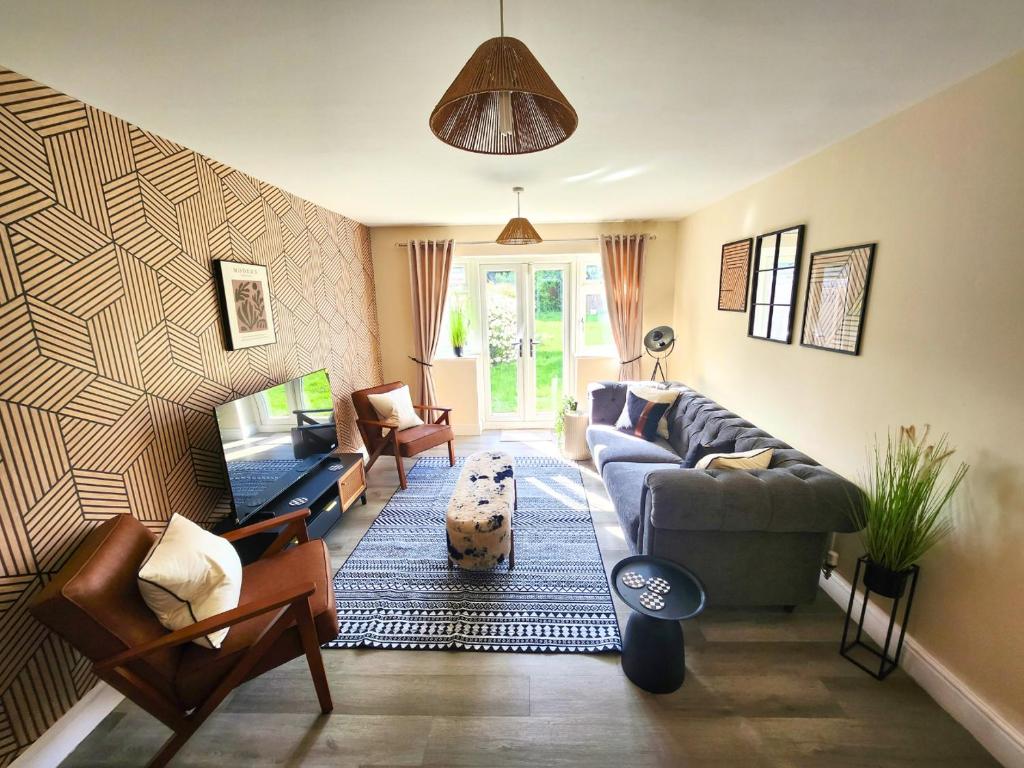 O zonă de relaxare la Lovely 5 bedroom House with Parking in Aylesbury