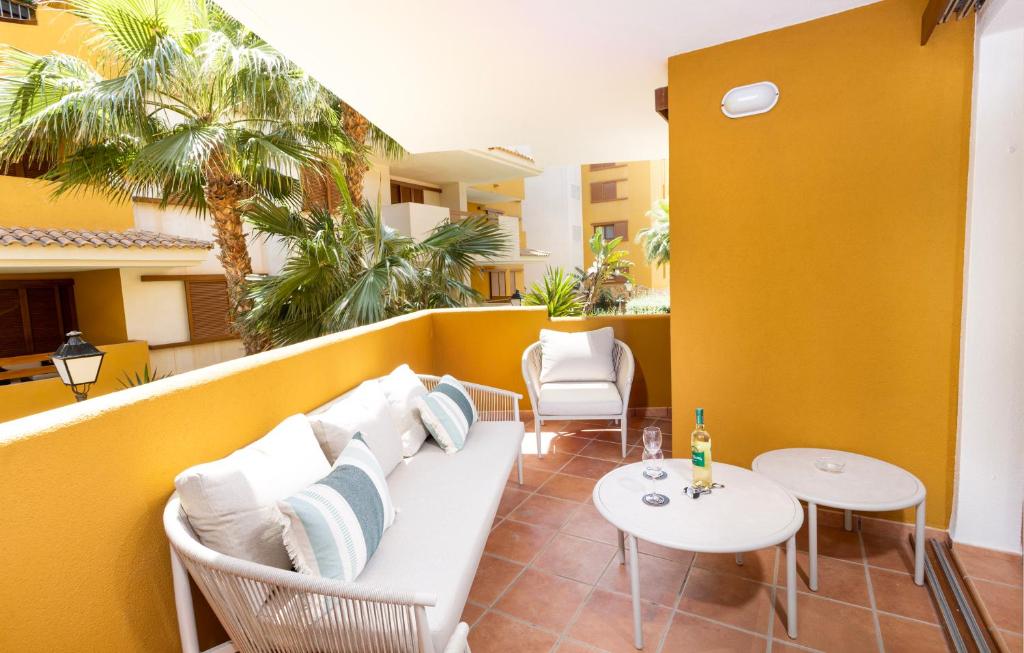 a living room with a couch and chairs on a balcony at CC8 III by ZANIS in Torrevieja