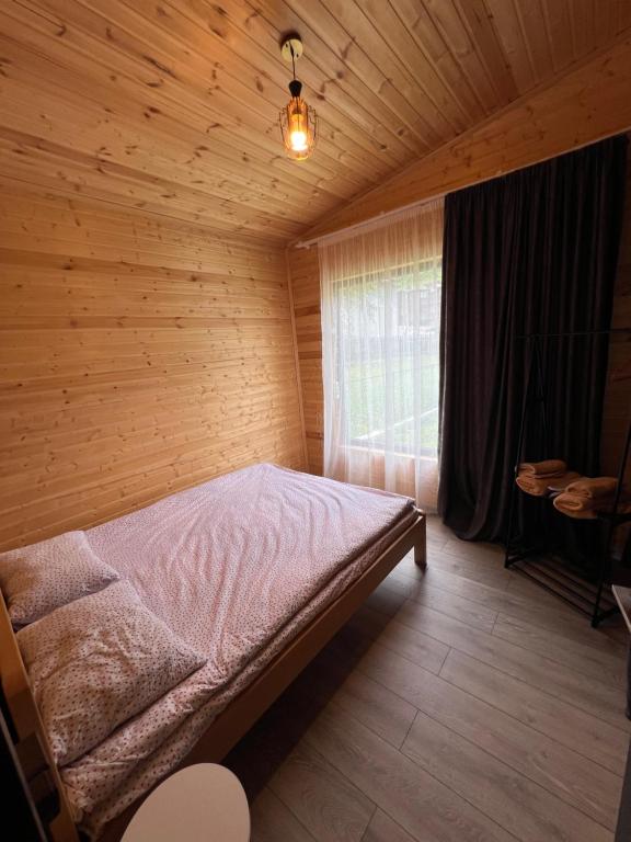 Postel nebo postele na pokoji v ubytování Pele's Cottages