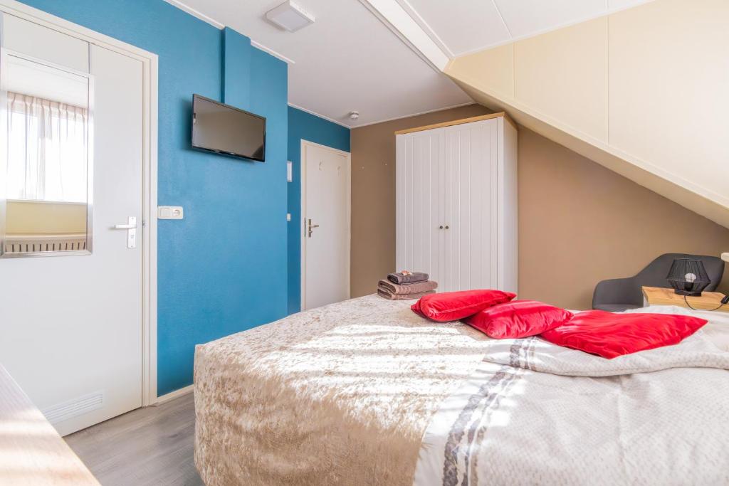 Postel nebo postele na pokoji v ubytování B&B Plompetorenzicht