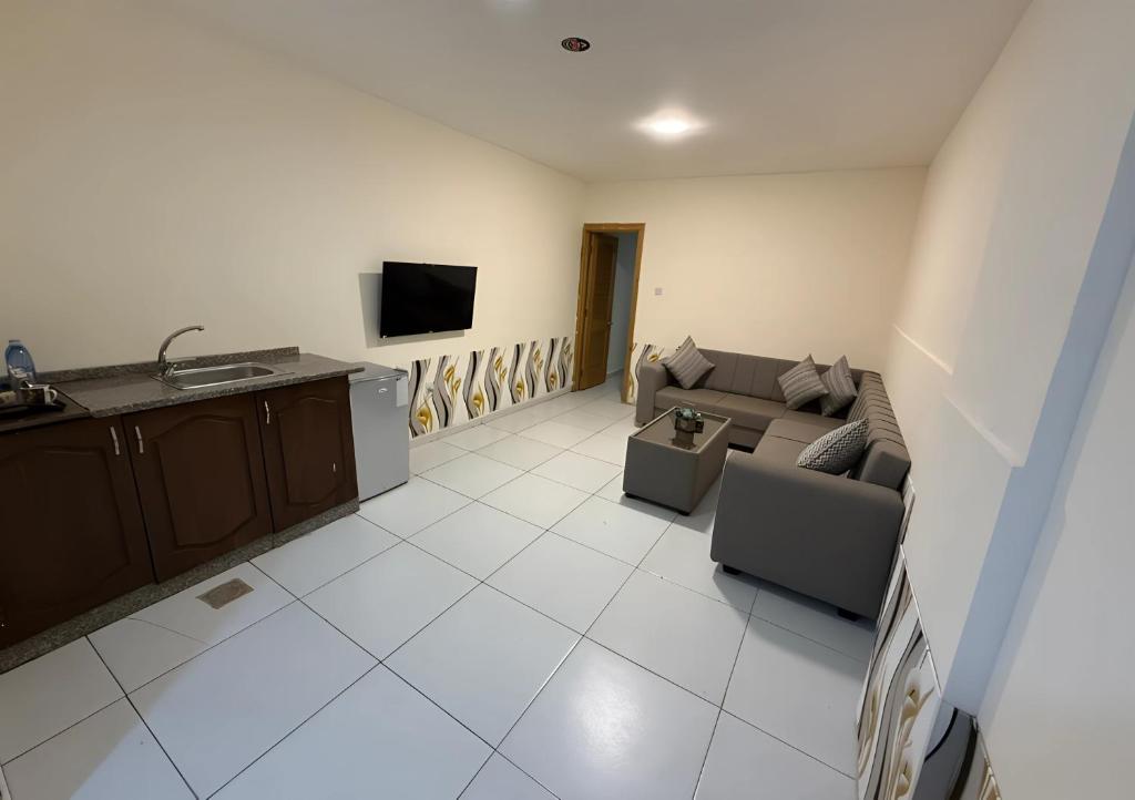 TV a/nebo společenská místnost v ubytování Ryan Hotel Suites