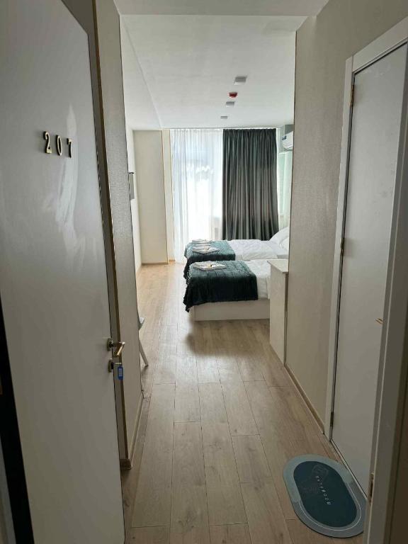 Postel nebo postele na pokoji v ubytování Hotel Caucasus