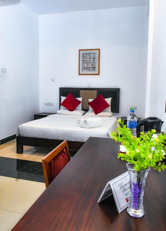 Postel nebo postele na pokoji v ubytování Hotel 198 Negombo