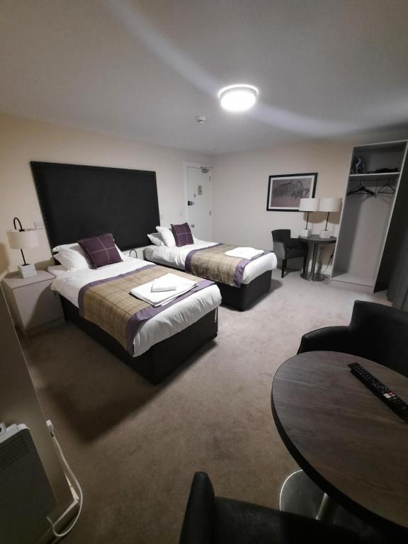 Postel nebo postele na pokoji v ubytování Dalkeith Aparthotel