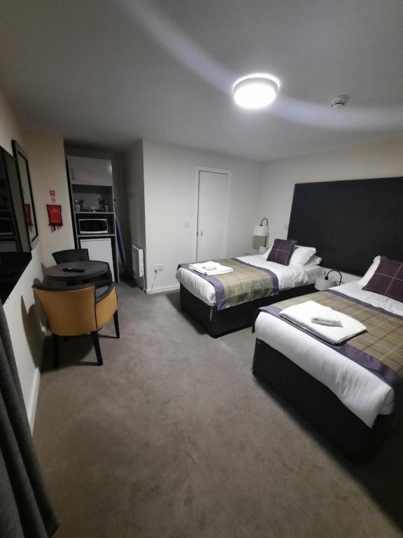 Postel nebo postele na pokoji v ubytování Dalkeith Aparthotel