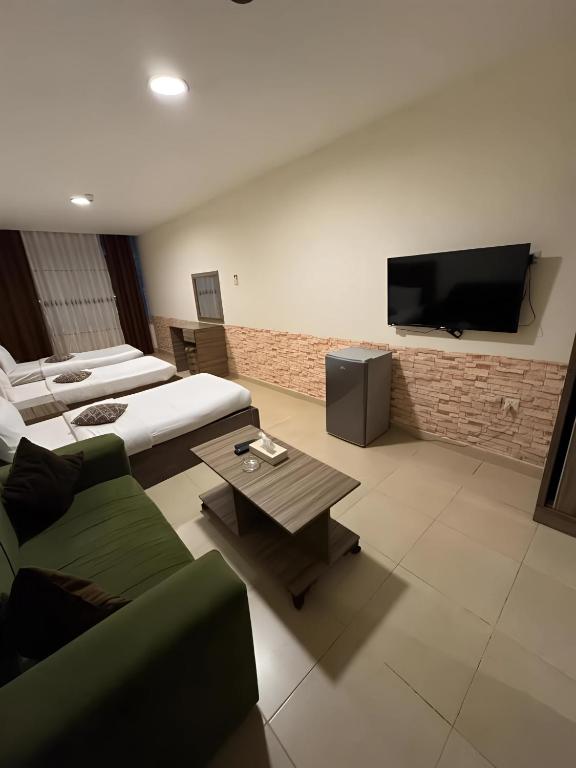 TV a/nebo společenská místnost v ubytování Ryan Hotel Suites