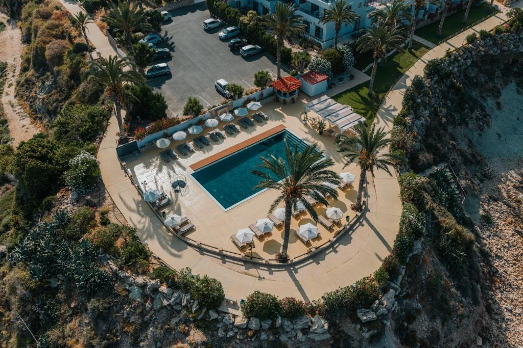an aerial view of a resort with a swimming pool at Vrachia Beach Hotel & Suites - Adults Only in Paphos