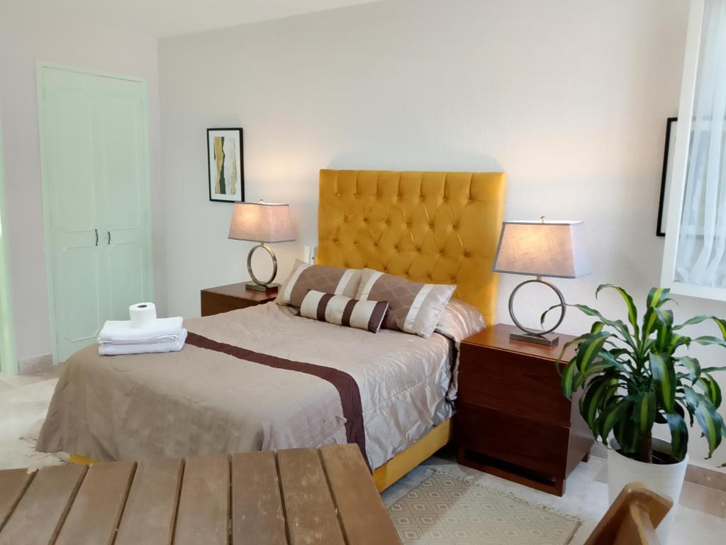 Ένα ή περισσότερα κρεβάτια σε δωμάτιο στο Casa Esmeralda