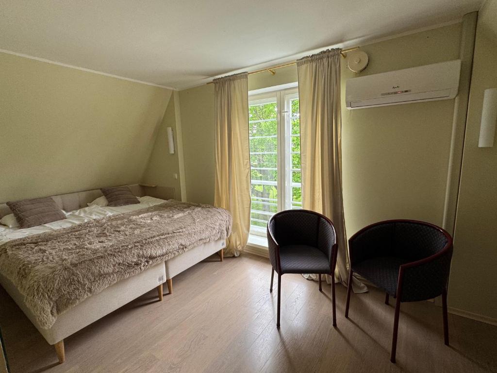 Postel nebo postele na pokoji v ubytování Inge Villa Apartment Hotel