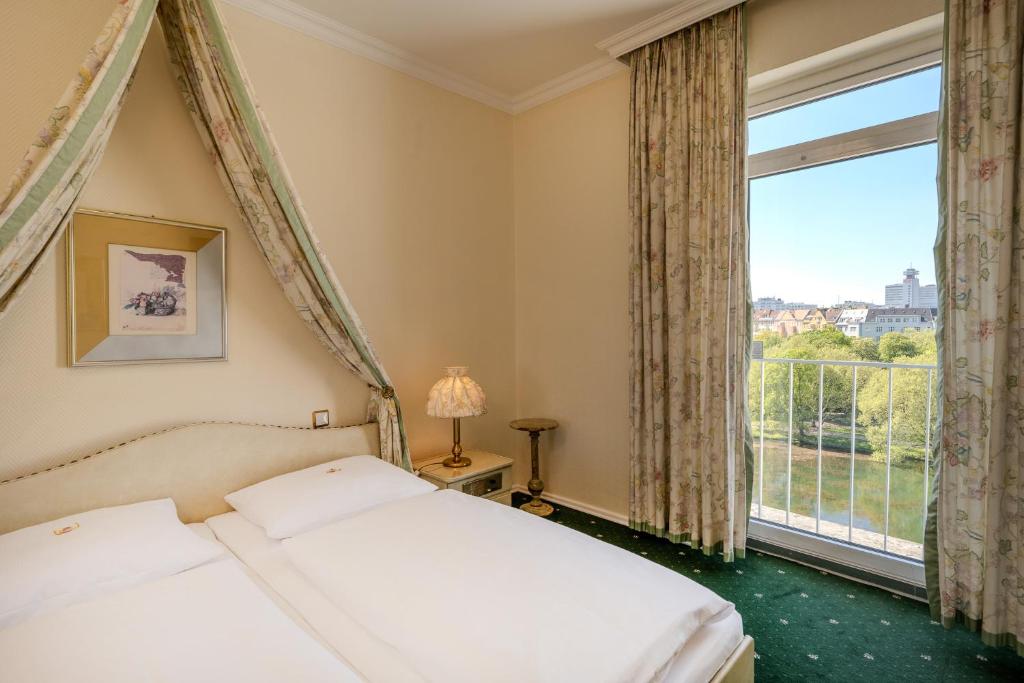 Postel nebo postele na pokoji v ubytování Ringhotel Seehof