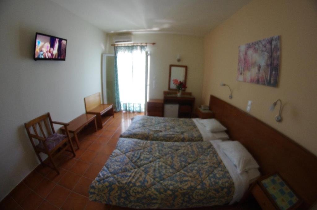Postel nebo postele na pokoji v ubytování SeaBird Hotel