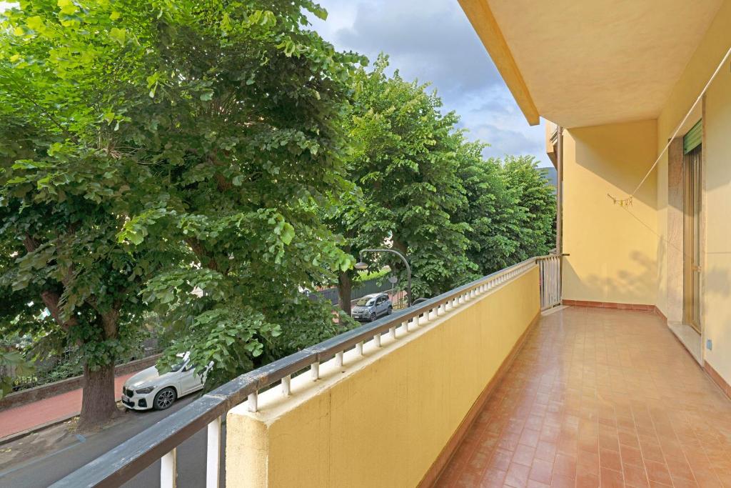a balcony of a building with a car on the street at Casa Nonna Adri in Levanto