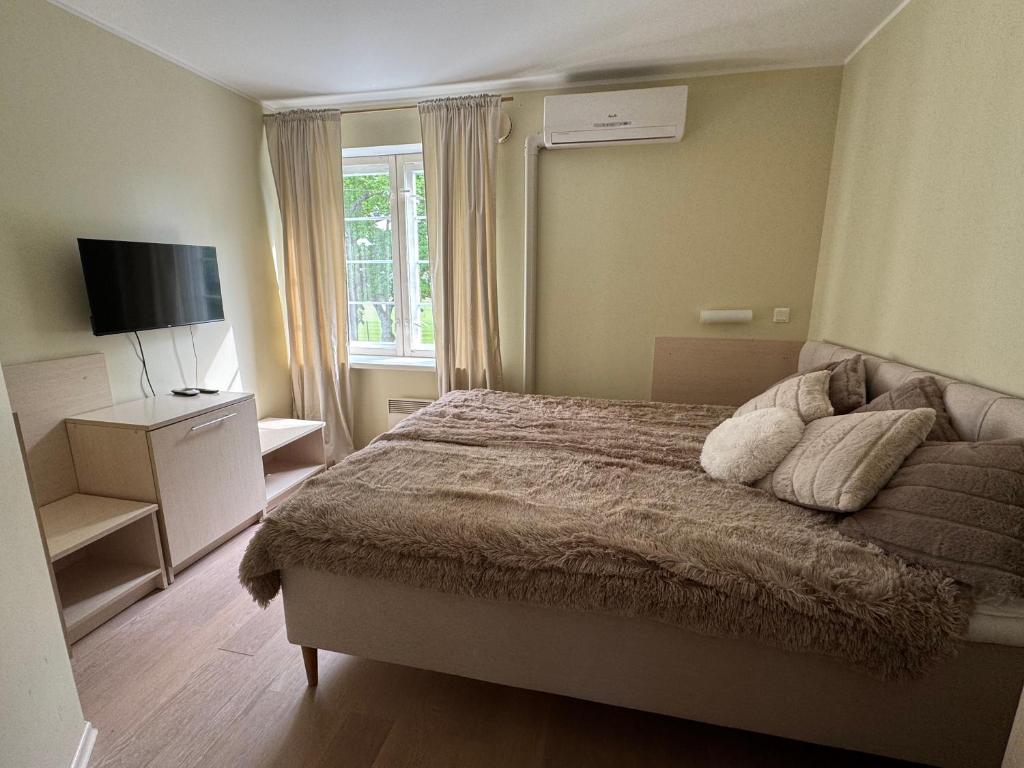 Postel nebo postele na pokoji v ubytování Inge Villa Apartment Hotel