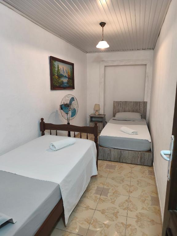 Postel nebo postele na pokoji v ubytování oneTwoSleep GuestHouse