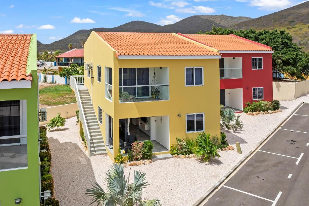 an aerial view of a house with a parking lot at Apartement Punta Azul 12A, Punta Azul Ocean Resort, Westpunt in Sabana Westpunt
