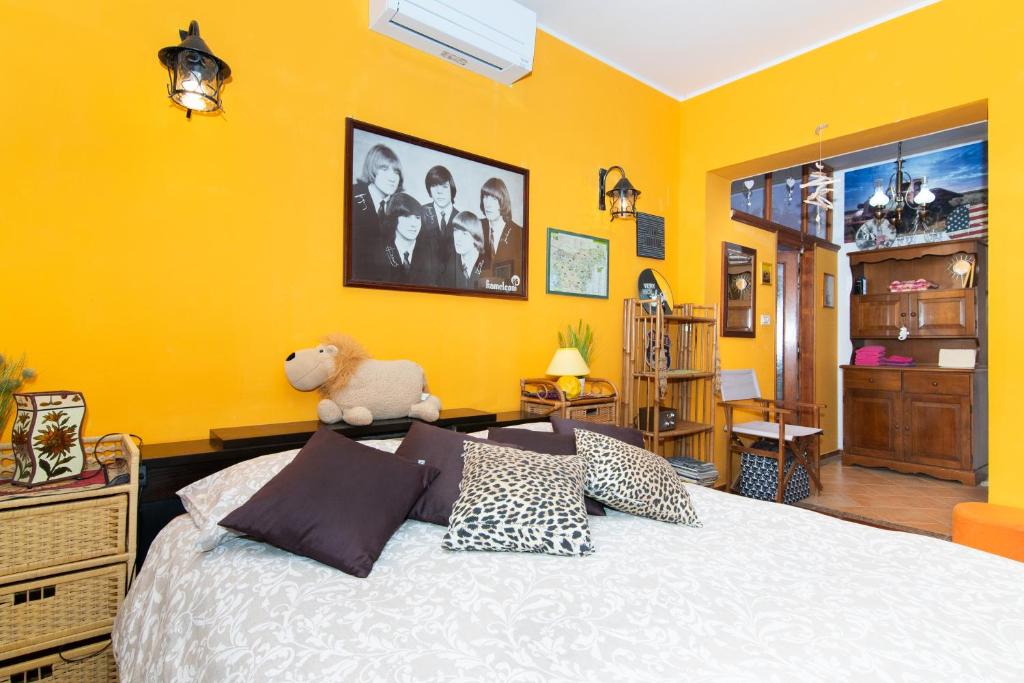 a bedroom with a bed with a teddy bear on it at Apartments Baredi in Izola