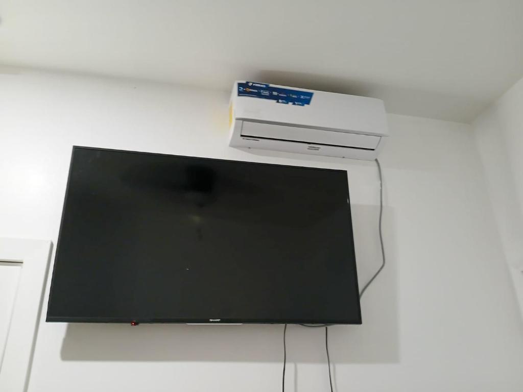 TV a/nebo společenská místnost v ubytování Alojamiento Los Andes