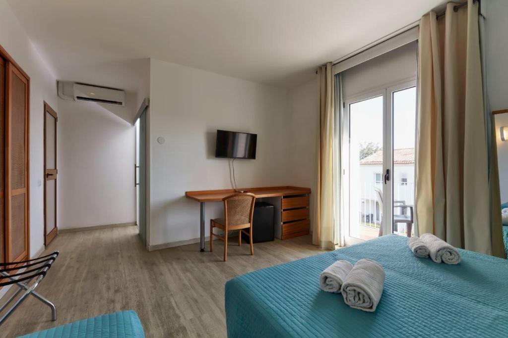 Voodi või voodid majutusasutuse I Giardini di Athena- Athena Resort toas