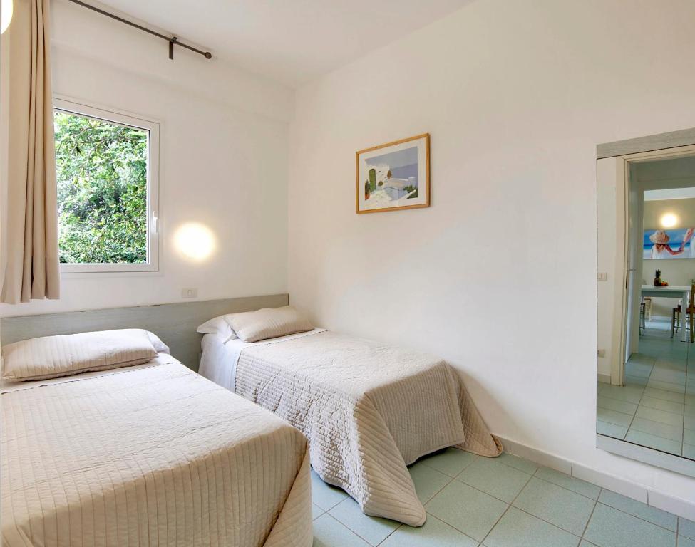 Voodi või voodid majutusasutuse I Giardini di Athena- Athena Resort toas