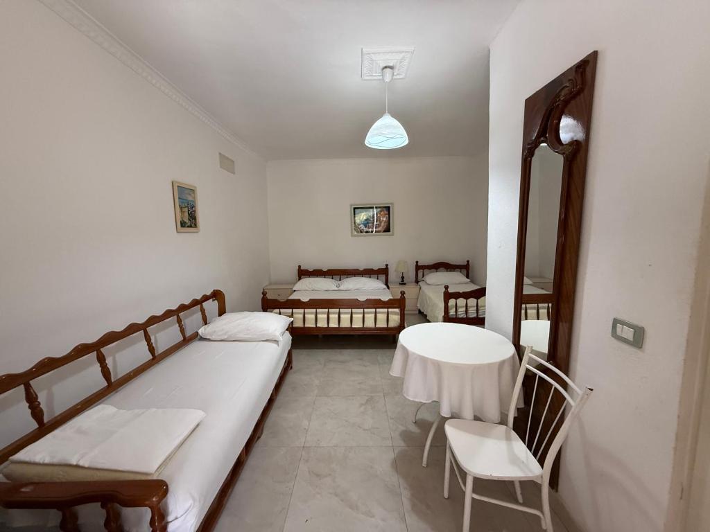 Postel nebo postele na pokoji v ubytování GuestHouse NOVI