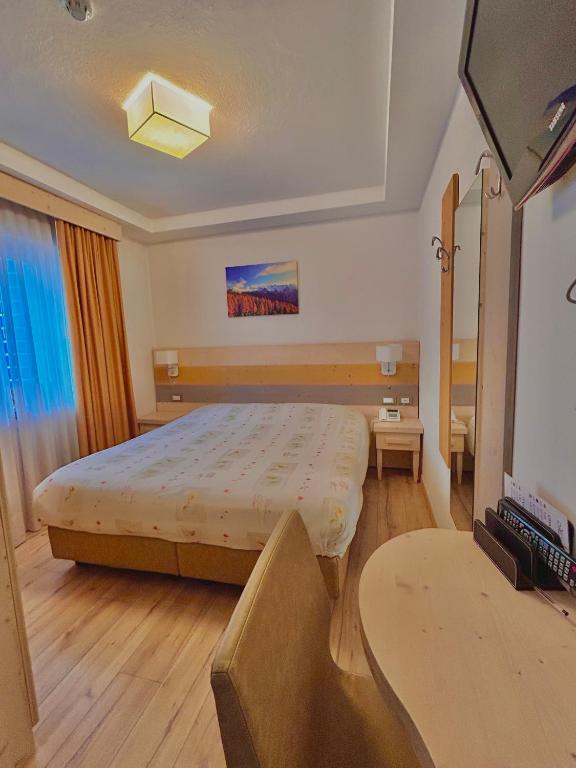 Łóżko lub łóżka w pokoju w obiekcie Hotel Centrale