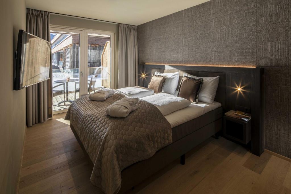 Letto o letti in una camera di Berg & Golf Resort Westendorf by ALPS RESORTS