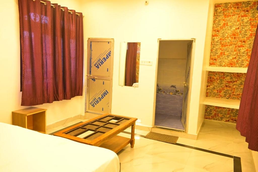 Voodi või voodid majutusasutuse Bajrangbali guest house toas