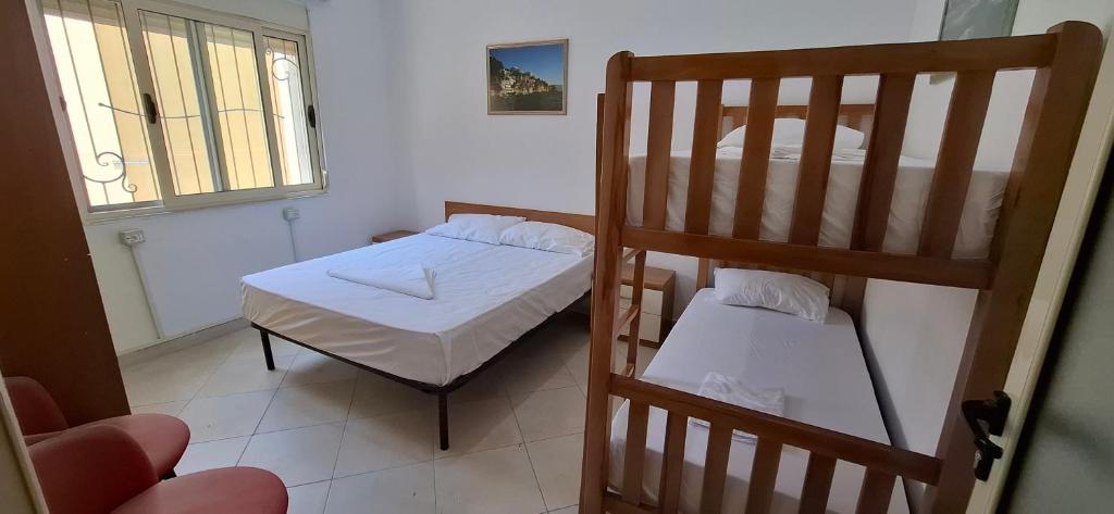 Postel nebo postele na pokoji v ubytování TreRacat Apartment