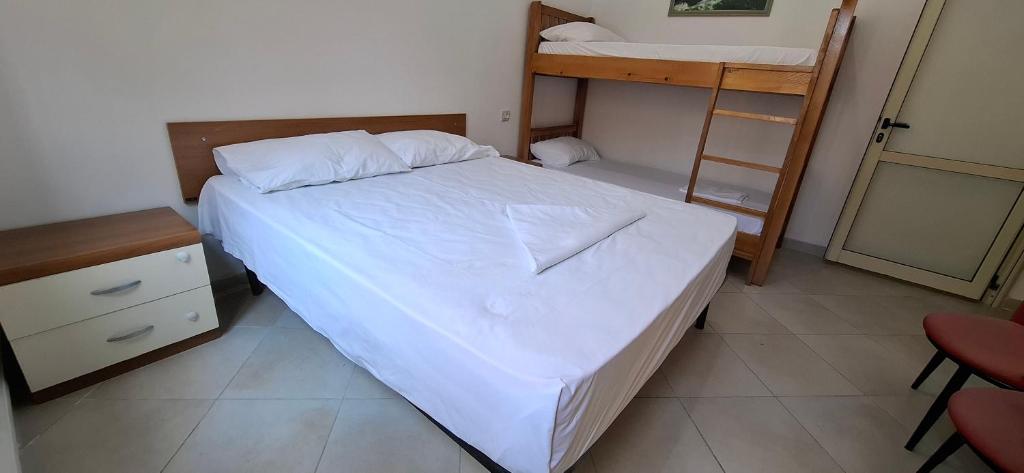 Postel nebo postele na pokoji v ubytování TreRacat Apartment
