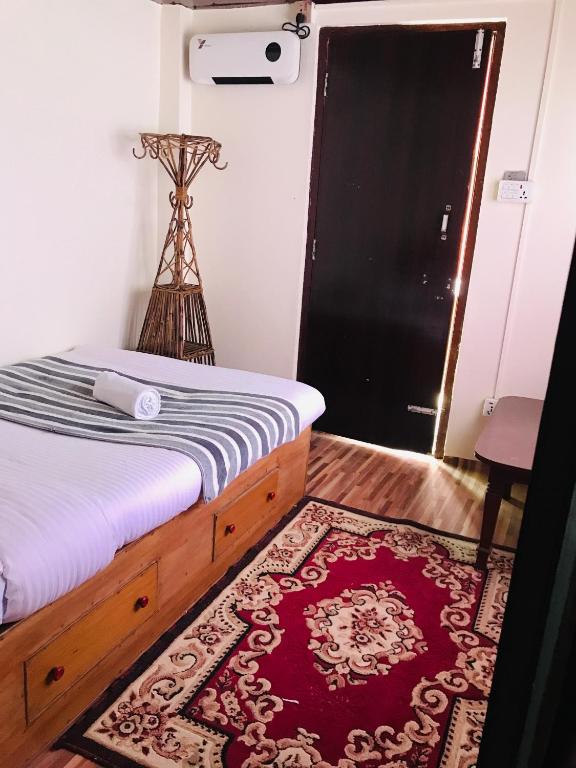 Rúm í herbergi á Mita Hotel-Resort Marga