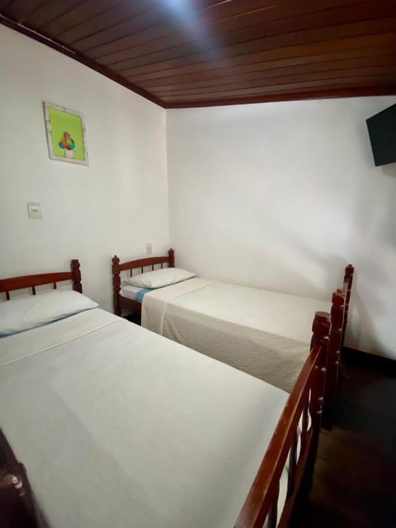 Postel nebo postele na pokoji v ubytování Pousada Juliana