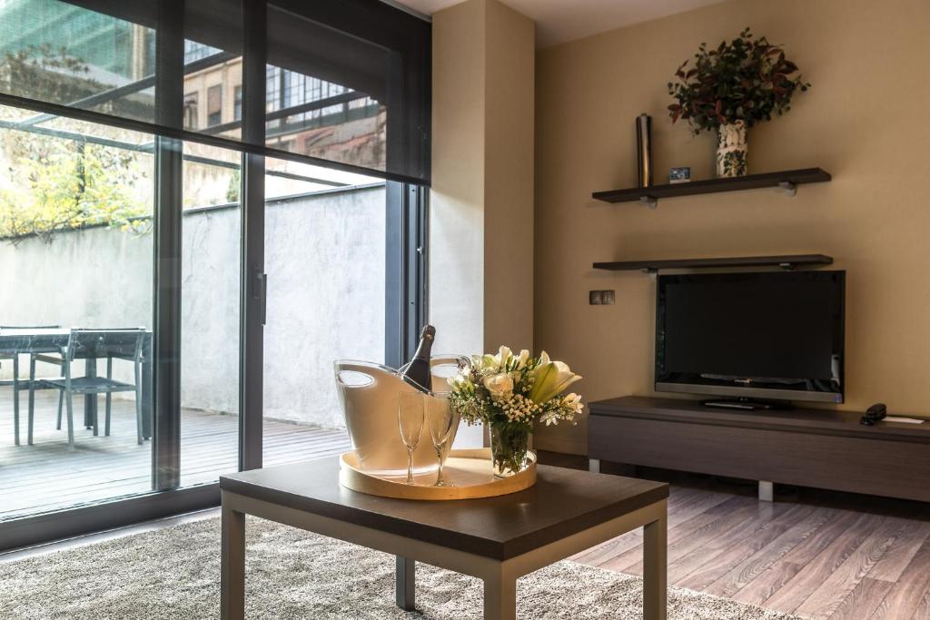 TV a/nebo společenská místnost v ubytování Casp 74 Apartments