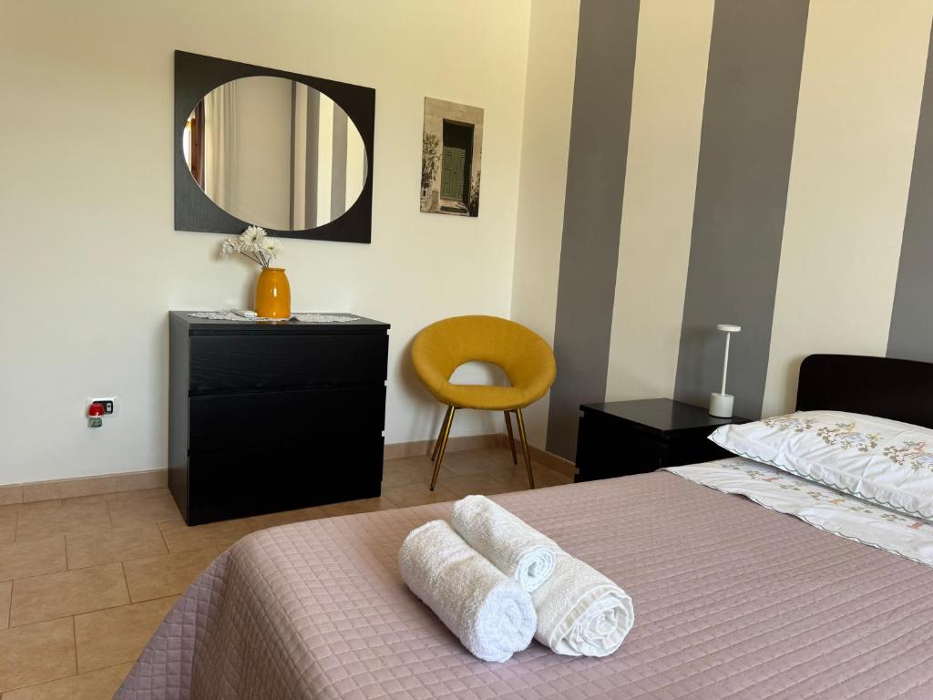 A bed or beds in a room at La Corte di Nunu'