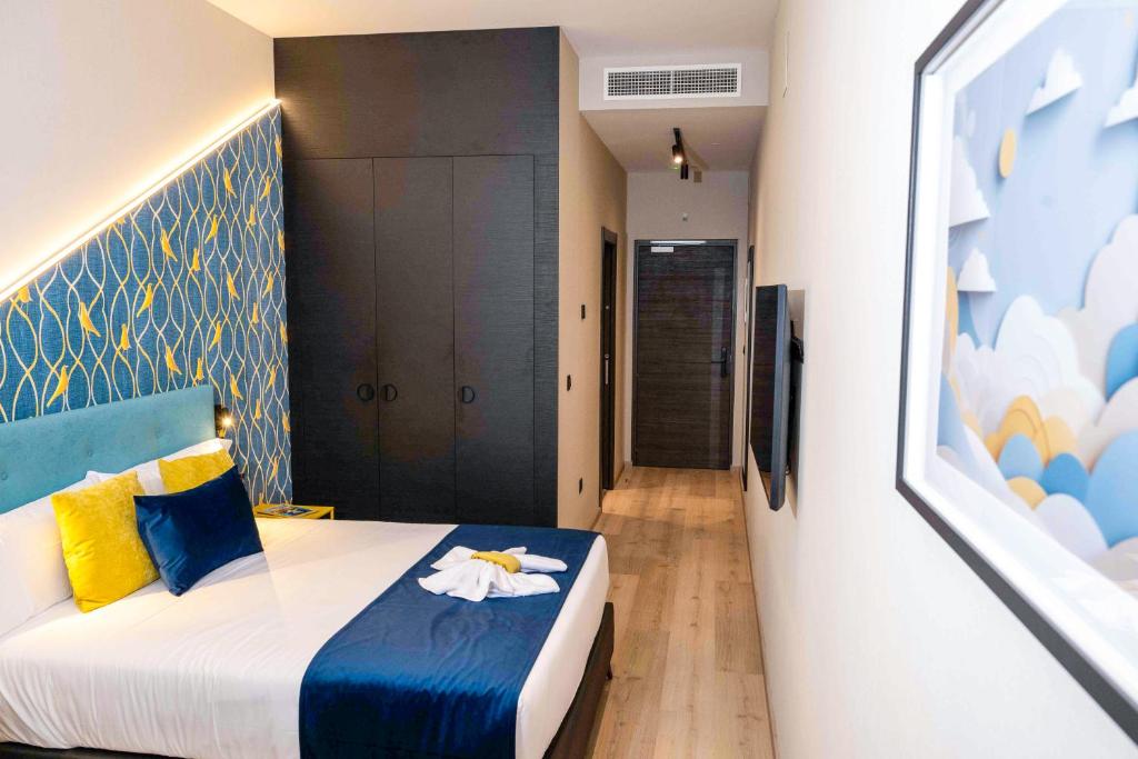 Postel nebo postele na pokoji v ubytování Hotel Pathos by Mimood Aparthotels