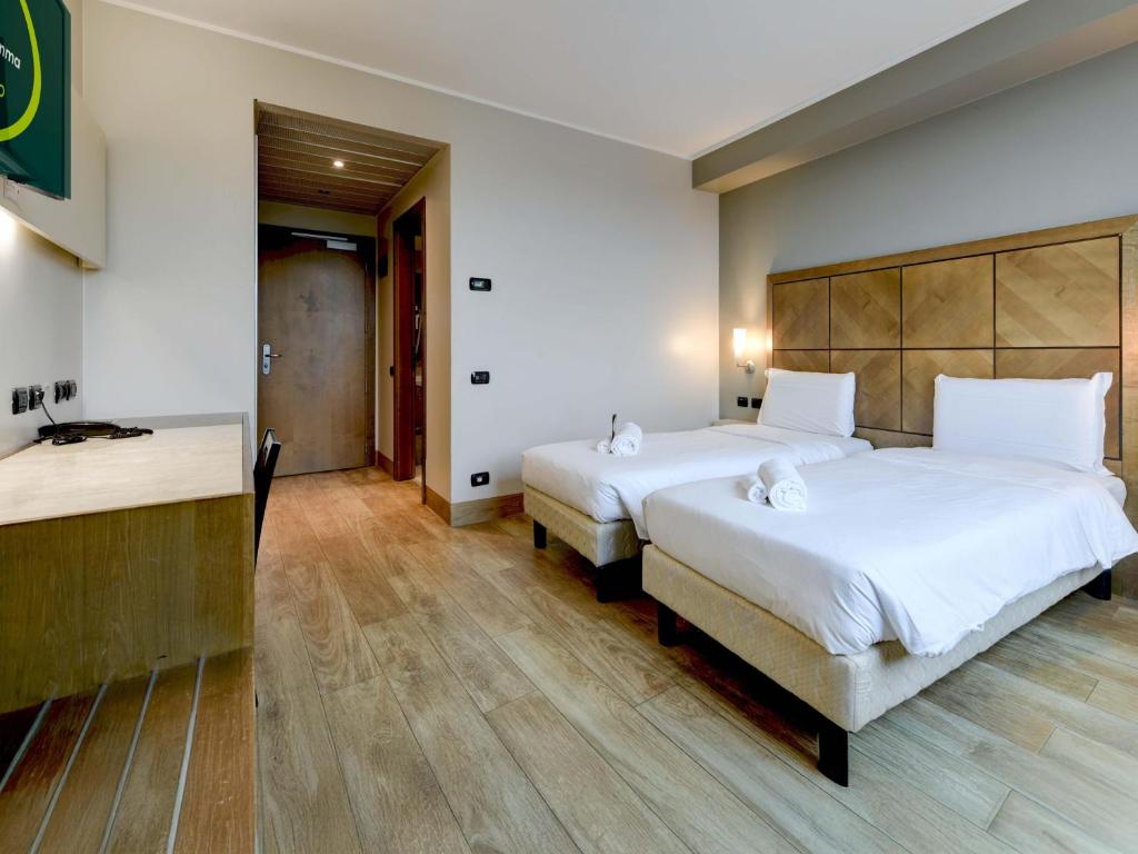 Postel nebo postele na pokoji v ubytování B&B HOTEL Padova