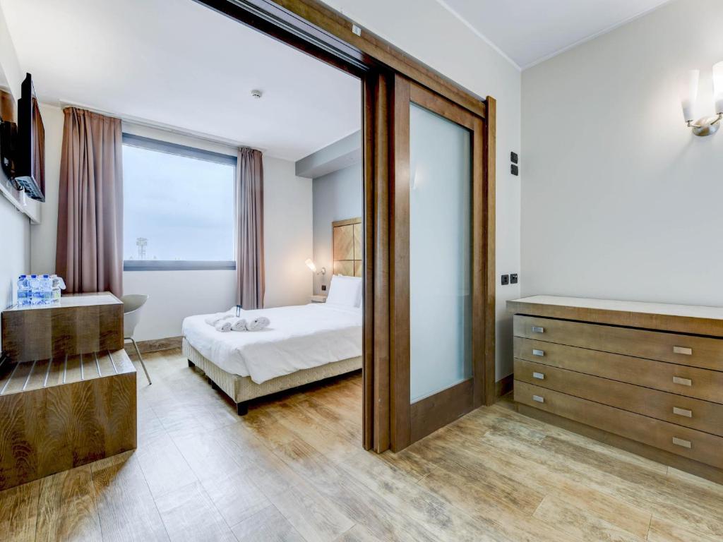 Postel nebo postele na pokoji v ubytování B&B HOTEL Padova