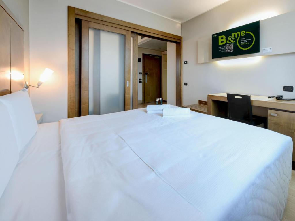 Postel nebo postele na pokoji v ubytování B&B HOTEL Padova